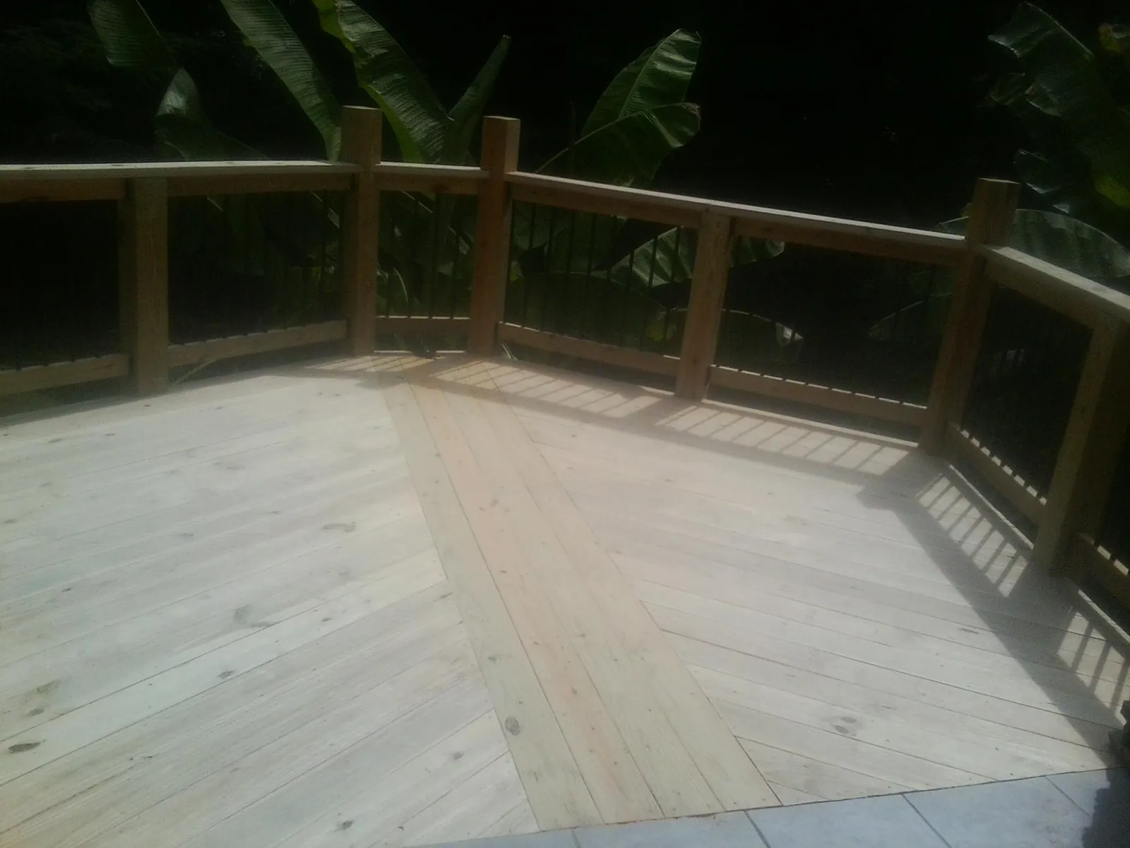 New wood deck and railing built off the back of a home in West Plains